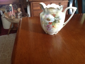 Small floral pitcher marked RS Prussia. 